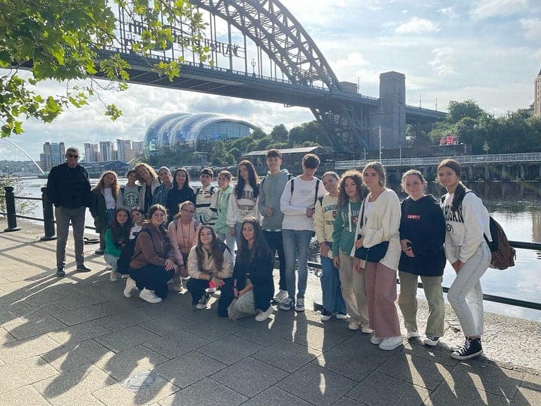 Students out in Newcastle city centre by the Millennium Bridge