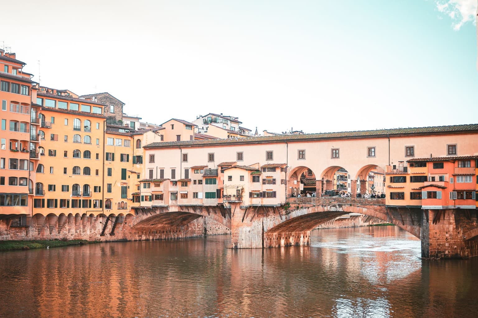 The Ponte Vecchio over the Arno in Florence, its shops reflected in the river